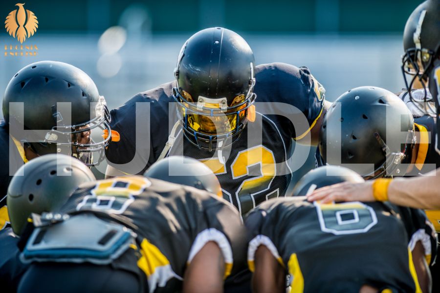 an image about A few athletes gathered together to plan the game