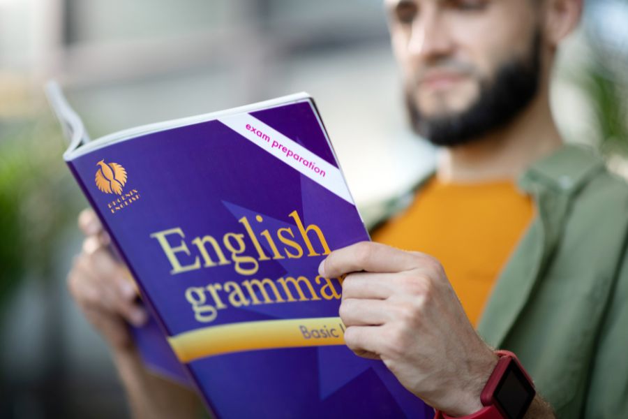 an pic about A man reading an English grammar book