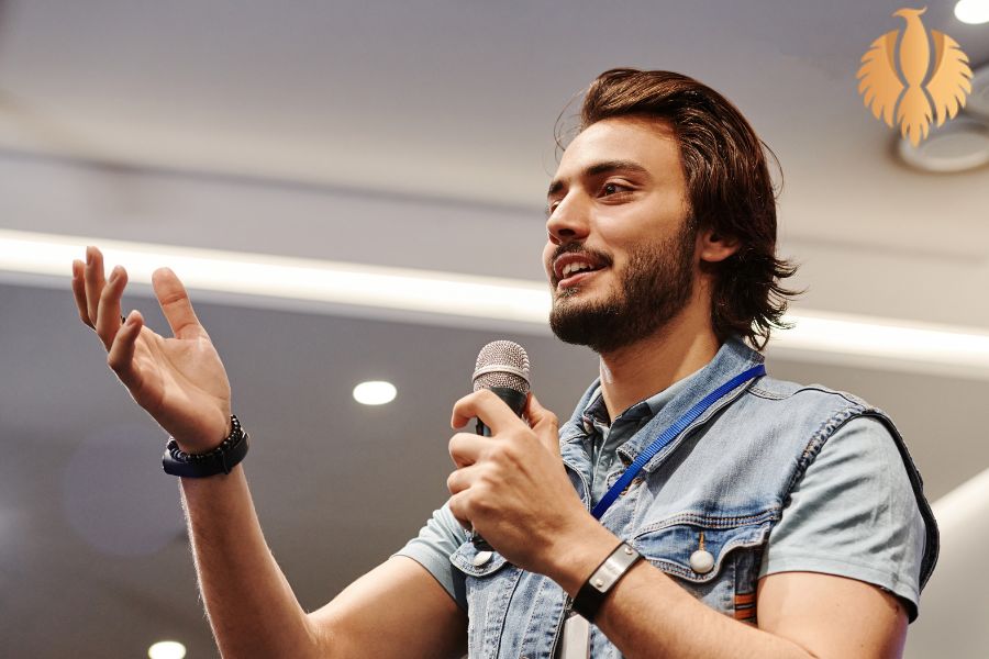 A photo about a man talking into a microphone