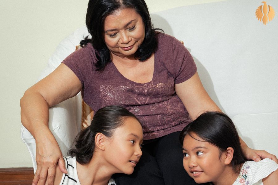 A photo about a woman taking care of her children